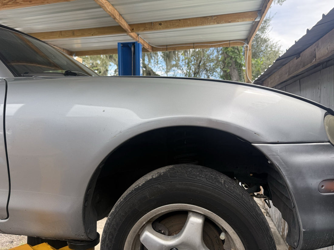 1999 Mazda Miata Passenger front fender (scuffs)